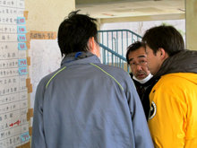 Scientology Volunteer Ministers reviewing the location of shelters in the Miyagi Prefecture.