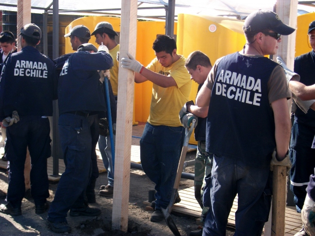Assisting the Armada de Chile (Chilean Navy) in the construction of permanent shelters, May 2010.